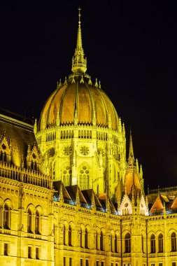 The scenic Gothic styled dome of Hungarian Parliament in night illumination, Budapest clipart