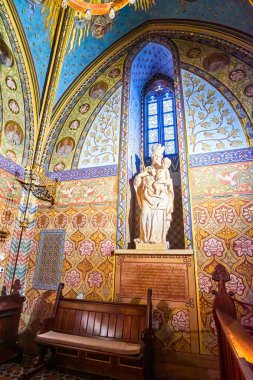 BUDAPEST, HUNGARY - FEBRUARY 28, 2022: The chepel in Matthias Church with small sculpture of Vingin Mary with a Child, on February 21 in Budapest, Hungary clipart