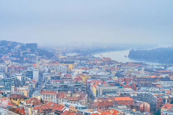 stock image The misty cityscape of residential neighborhood and Margaret Bridge on background, Budapest, Hungary