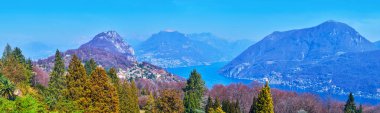 Panorama from the viewing terrace, located on the hilltop in Parco San Grato and observing Lake Lugano and Lugano Prealps, Carona, Ticino, Switzerland clipart