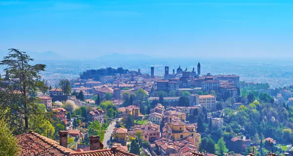 stock image Panoramic landscape with medieval Upper City of Bergamo atop the hill from the San Vigilio Hill, Lombardy, Italy