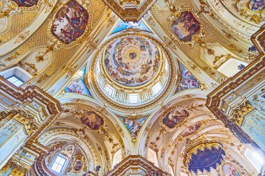 BERGAMO, ITALY - APRIL 7, 2022: Bergamo Cathedral boasts impressive vault decoration with frescoes, stucco reliefs, gilt patterns, Bergamo, Italy clipart