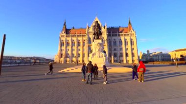 Gyula Andrassy equestrian statue on Lajos Kossuth Square and Gothic Parliament building in the evening light, Budapest, Hungary
