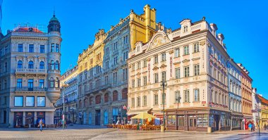 PRAGUE, CZECHIA - MARCH 8, 2022: Panorama of historic Rijna Street with beautiful townhouses, ornate House At the Golden Beehive and outdoor restaurants, Prague, Czechia clipart