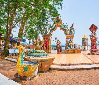 The sculptural composition of the Phra Chiang Saen Si Phaendin temple on the bank of Mekong river, Golden Triangle, Ban Sop Ruak, Thailand clipart