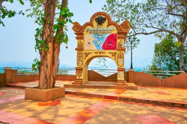 The signpoint with a map of Golden Triangle on the terrace with a lookout over the Mekong River, Ban Sop Ruak, Thailand clipart