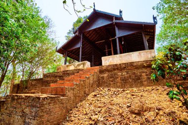 The entrance to the open air image house of Phrathat Pukhaw temple complex, Ban Sop Ruak, Thailand clipart