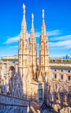 The iconic forest of spires on Milan Cathedral is a standout feature of this stunning Gothic masterpiece. clipart