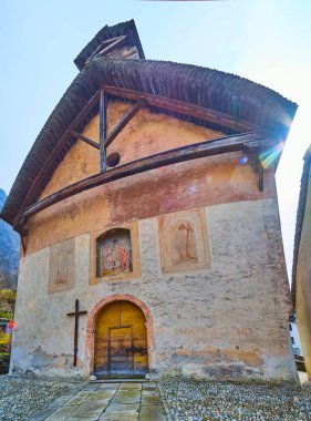 The medieval frescoes on the facade of the Church of San Martino, situated in Prato Sornico, Val Lavizzara, Vallemaggia, Ticino, Switzerland clipart