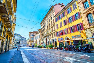 MILAN, ITALY - APRIL 11, 2022: Corso Magenta street, one of the main thoroughfare in historical neighborhood, on April 11 in Milan, Italy