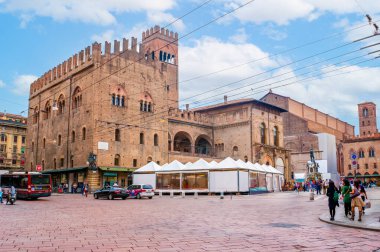 BOLOGNA, ITALY - SEPTEMBER 24, 2017: Medieval Palazzo Re Enzo is one of Bolognas most iconic medieval buildings located on Piazza del Nettuno, on September 24 in Bologna, Italy clipart