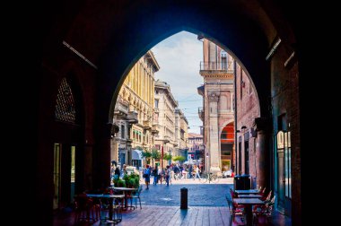 BOLOGNA, ITALY - SEPTEMBER 24, 2017: The view throught the arch of Palazzo Re Enzo on Piazza Re Enzo, on September 24 in Bologna, Italy clipart