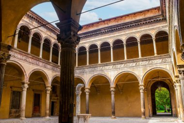 BOLOGNA, ITALY - SEPTEMBER 24, 2017: The courtyard of Palazzo Bevilacqua Ariosti with small drinking fountain in the middle, on September 24 in Bologna, Italy clipart