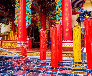 BANGKOK, THAILAND - MAY 12, 2019: The burning Chinese candles at Kuan Yim Shrine of Thian Fa Foundation, on May 12 in Bangkok, Thailand clipart