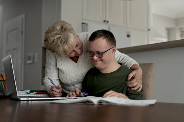 Mother Hugging Caucasian Man Syndrome While Learning Home — Stock Photo, Image