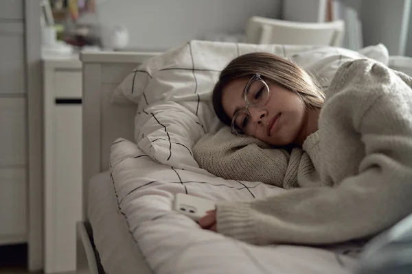 Sad Caucasian Teenage Girl Lying Bed Looking Her Phone Held — Stock Photo, Image
