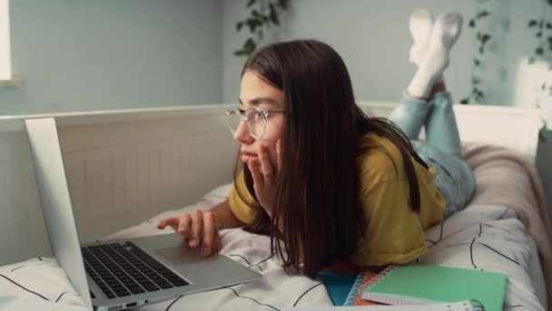 Caucasian Teenage Girl Lying Bed Front Doing Homework Shot Red — Stock Video