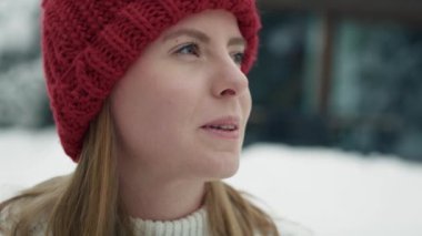 Close up of woman standing outdoors and enjoying the winter. Shot with RED helium camera in 8K. 