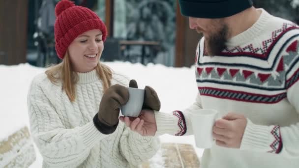 Caucasian Man Giving Hot Tea His Woman Winter Day Outdoors — Stockvideo