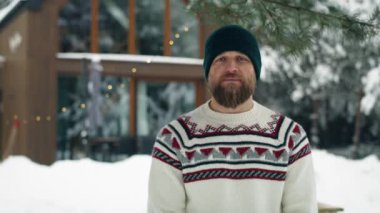 Portrait of man standing outdoors and enjoying the winter. Shot with RED helium camera in 8K. 