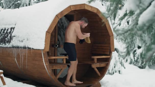 Caucasian Man Come Out Sauna Enter Barrel Frozen Water Shot — стоковое видео