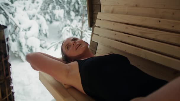 Caucasian Woman Enjoying Sauna Winter Shot Red Helium Camera — Stock videók