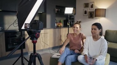 Women starting record a movie from home. Shot with RED helium camera in 8K. 