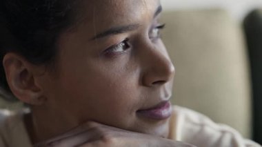 Close up of smiling woman looking away and spending time at home. Shot with RED helium camera in 8K.   