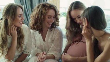 Group of smiling adult women celebrating together at baby shower. Shot with RED helium camera in 8K.  