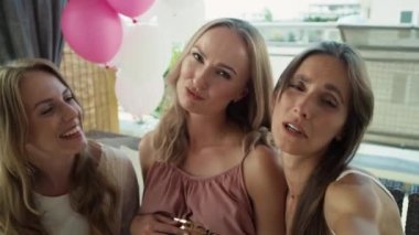 Group of women talking by video call from baby shower. Shot with RED helium camera in 8K.   