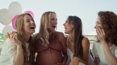 Group of smiling adult women at baby shower have fun together. Shot with RED helium camera in 8K.  