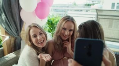 Group of adult women make a selfies at baby shower. Shot with RED helium camera in 8K.  