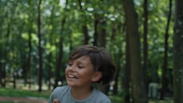 Caucasian Boy Running Playing Playground Shot Red Helium Camera — Vídeo de Stock