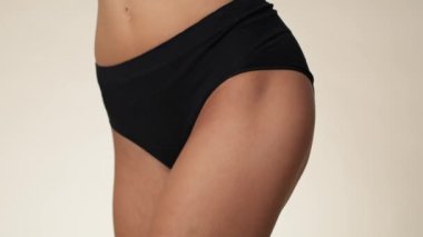 Close up of hip of unrecognizable woman in underwear. Shot with RED helium camera in 8K.