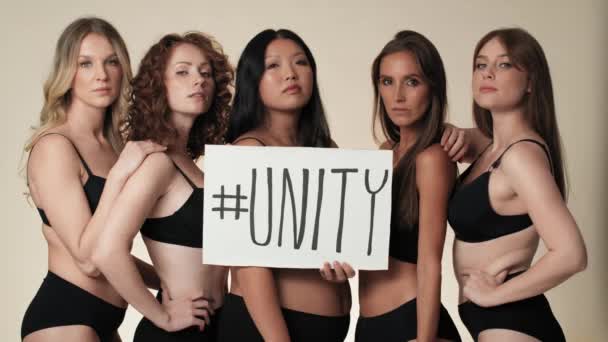 Portrait Group Serious Women Underwear Standing Studio Holding Banner Shot — Stock Video