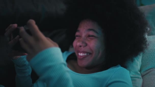 Teenage Girl Browsing Mobile Phone Living Room Night Having Fun — Stock Video