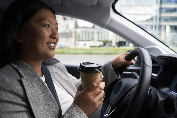 Chinese Woman Driving Car Holding Cup Coffee — Stock Photo, Image