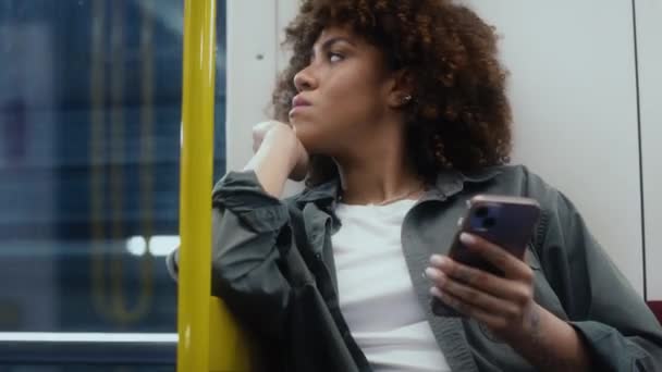 Young Afro Woman Traveling Underground Browsing Mobile Phone Shot Red — Stock Video