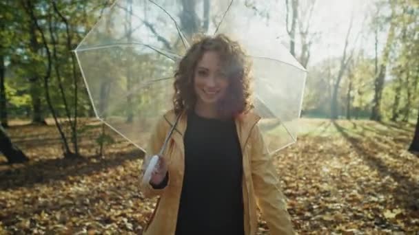 Caucasian Woman Transparent Umbrella Walking Autumn Park Shot Red Helium — Stock Video