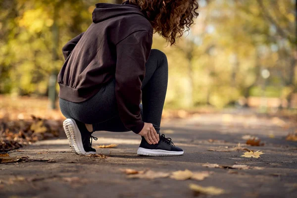 Side View Woman Squatting Feeling Ankle Injury Jogging Park — Stock Photo, Image
