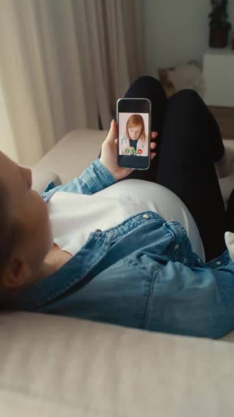 Pregnant Woman Lying Sofa Having Video Call Doctor — Stock Video