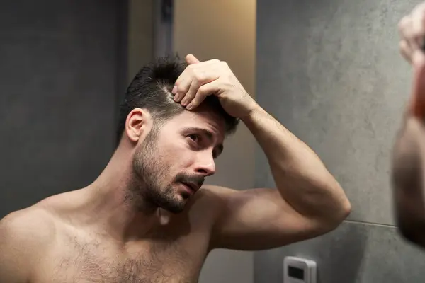 Caucasian Man Checking Hair Condition Bathroom — Stock Photo, Image