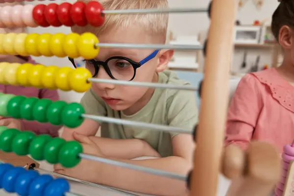 Preschool Boy Using Abacus Kindergarten Royaltyfria Stockbilder