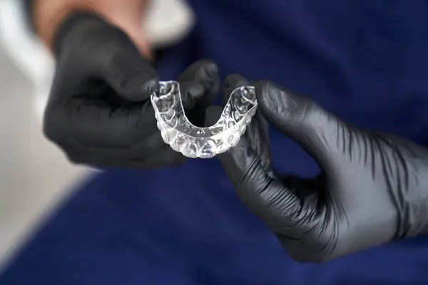 Dentist Holding Retainers His Hands Imagens Royalty-Free