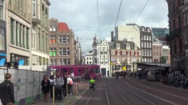 Netherlands, Amsterdam - September 27, 2021: View from a moving tram on a narrow street in the city center