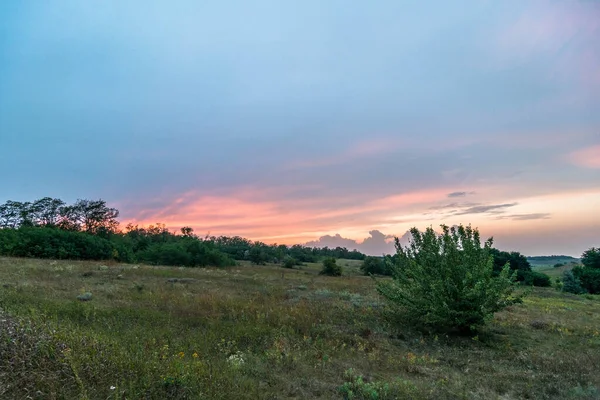 Landscape of Ukraine. Day and Night . Sunrise in forest . Village house .