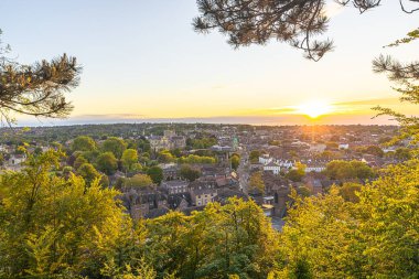 Winchester - June 02 2022: Sunset in the medieval town of Winchester in Wessex, England. clipart