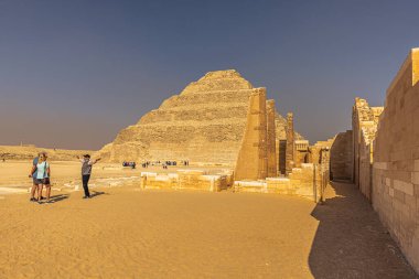 Saqqara, Egypt -  November 14, 2021: Pyramid of ancient Egyptian Pharaoh Djoser in Saqqara, Egypt clipart