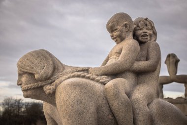 Oslo - February 11 2023: Statues in the famous Vigeland Park in Oslo, Norway clipart