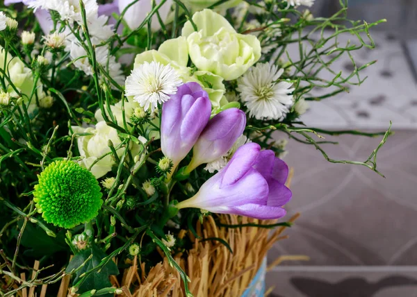 An Easter floral decoration with freesia flowers. Festive decor